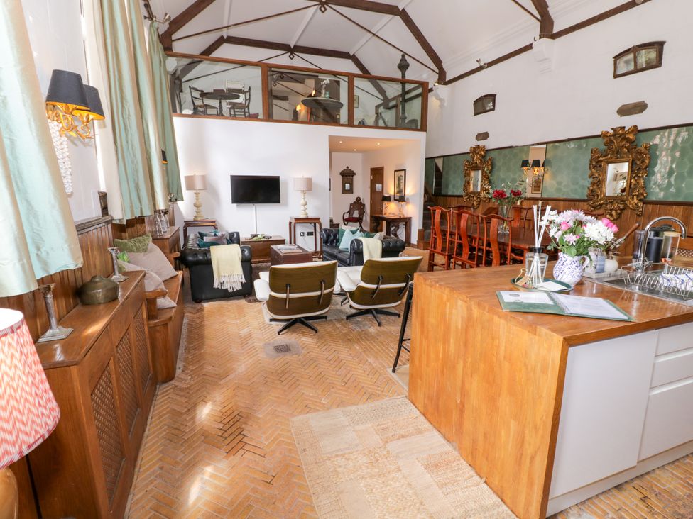 A living room with a sofa and television at Chetwynd Lodge Ingestre near Great Haywood