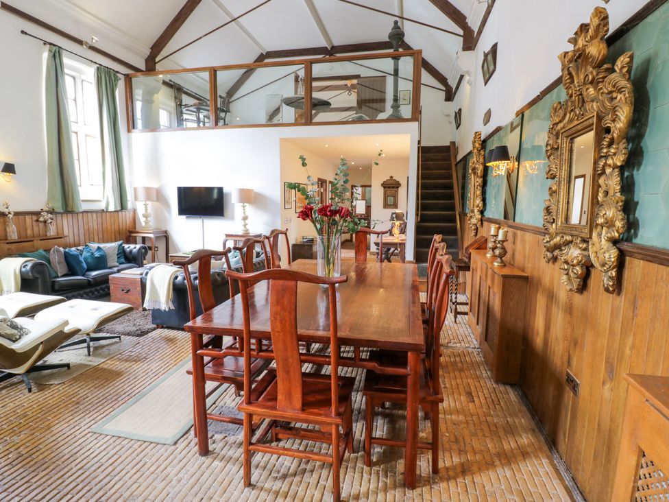 A dining room with a table and chairs at Chetwynd Lodge Ingestre near Great Haywood