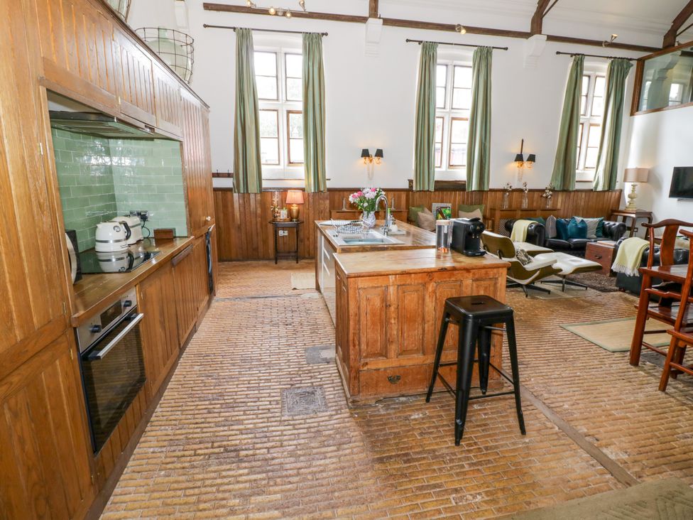 A kitchen with island and sink at Chetwynd Lodge Ingestre near Great Haywood