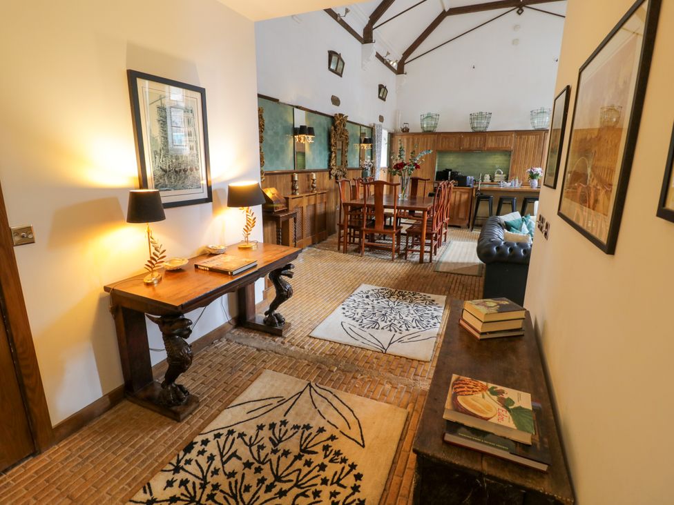 A living room with a dining area and kitchen at Chetwynd Lodge Ingestre near Great Haywood