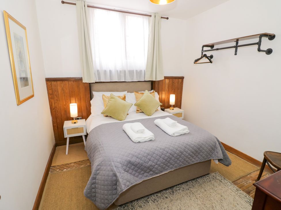 A bedroom with a double bed and bedside tables at Chetwynd Lodge Ingestre near Great Haywood