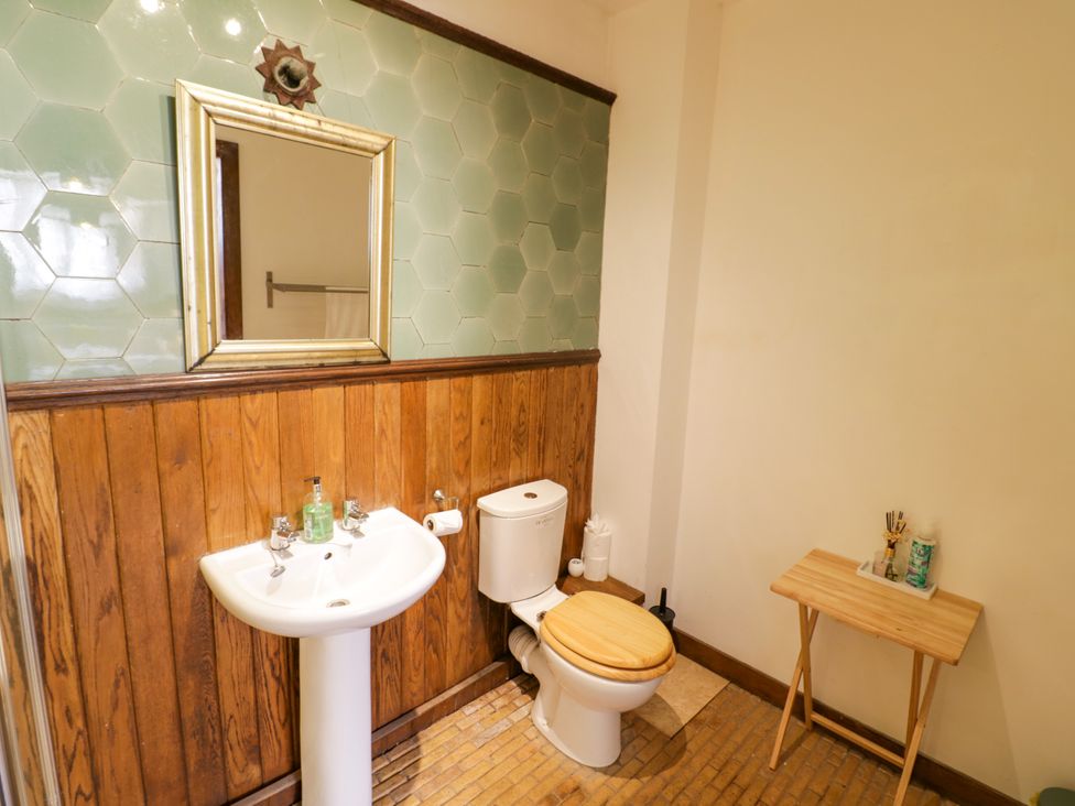 A bathroom with sink and toilet at Chetwynd Lodge Ingestre near Great Haywood
