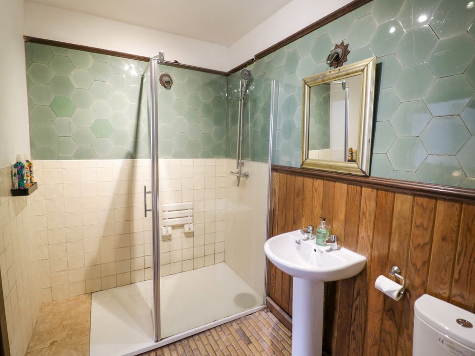 A bathroom with a shower and sink at Chetwynd Lodge Ingestre near Great Haywood