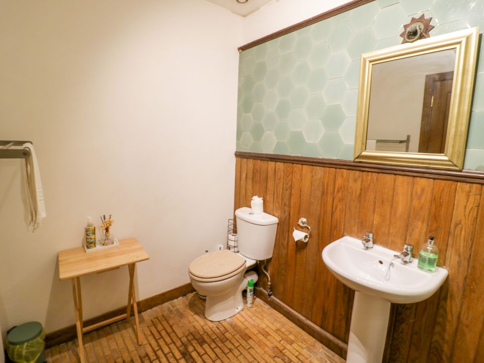 A bathroom with a sink and toilet at Chetwynd Lodge Ingestre near Great Haywood