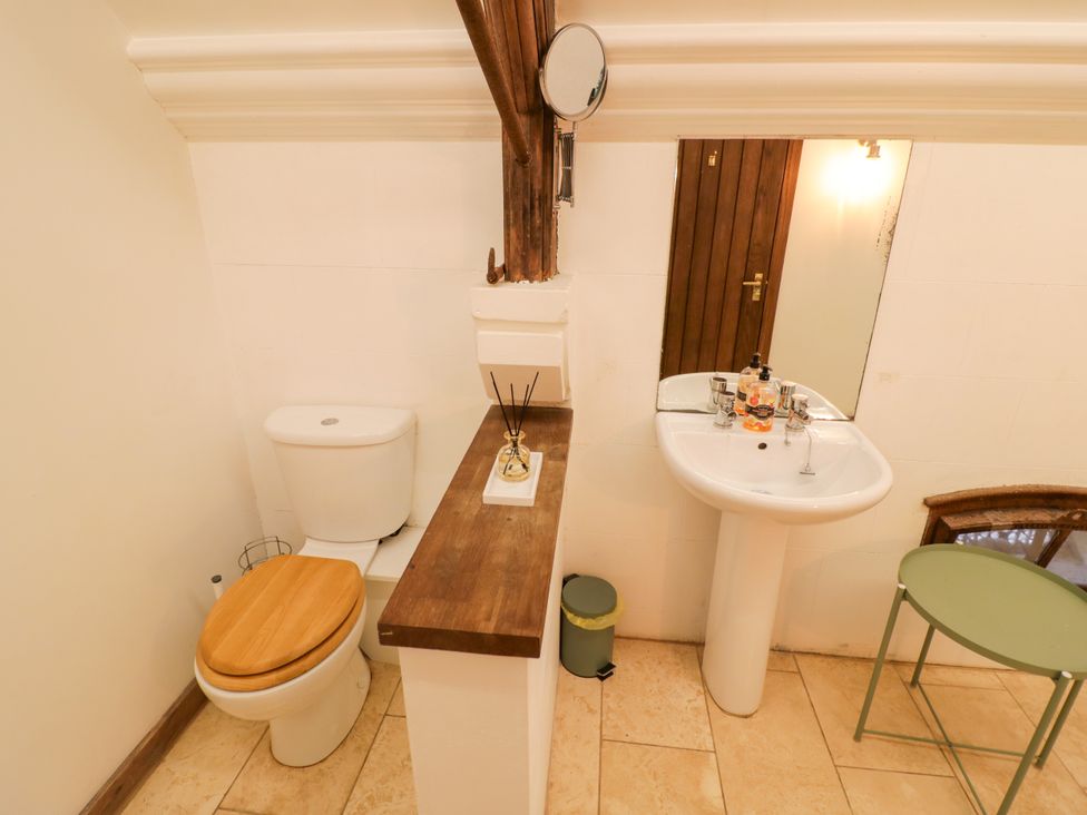 A bathroom with a sink and toilet at Chetwynd Lodge Ingestre near Great Haywood