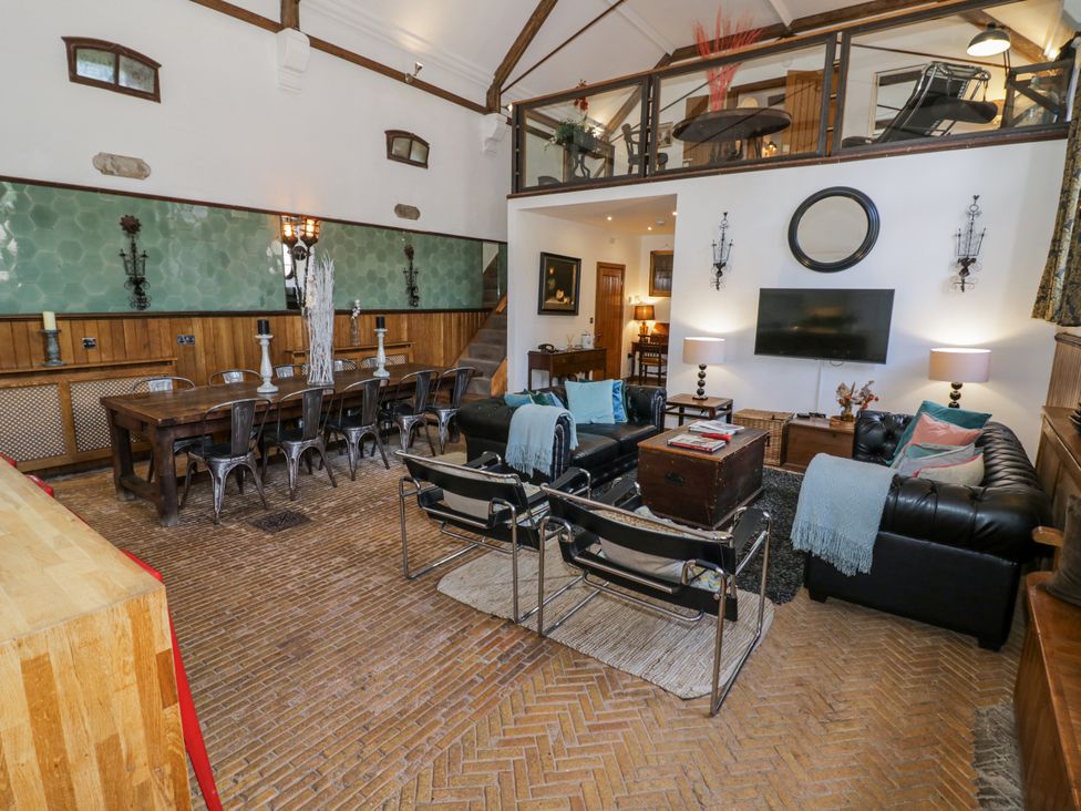 A living room with a dining table and sofa at Talbot Lodge Ingestre near Great Haywood