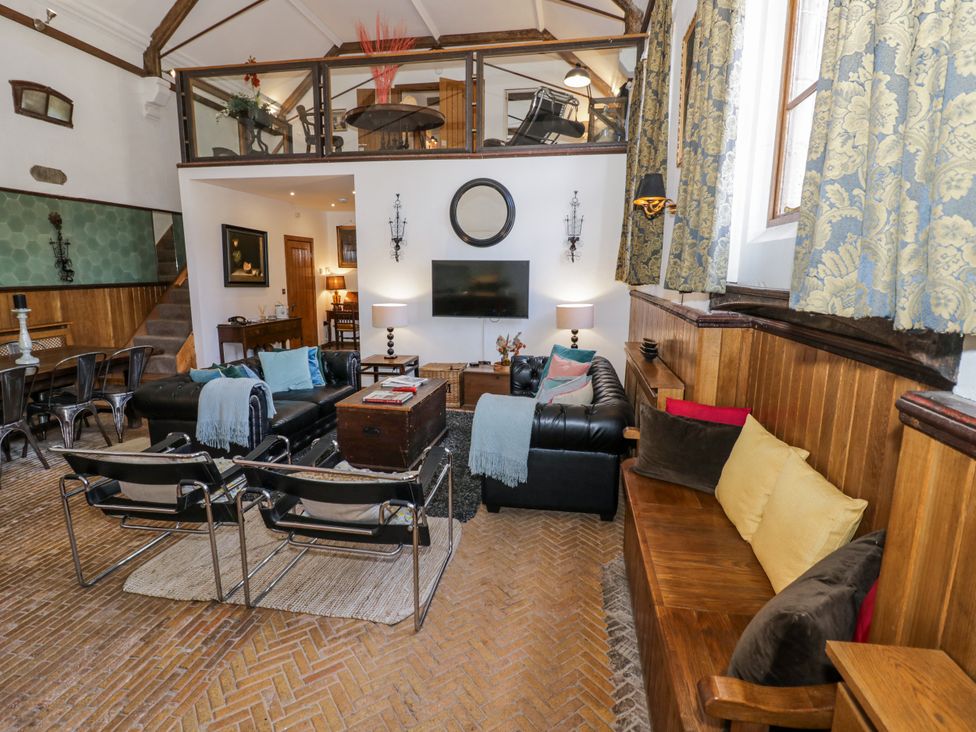 A living room with a sofa and coffee table at Talbot Lodge Ingestre near Great Haywood