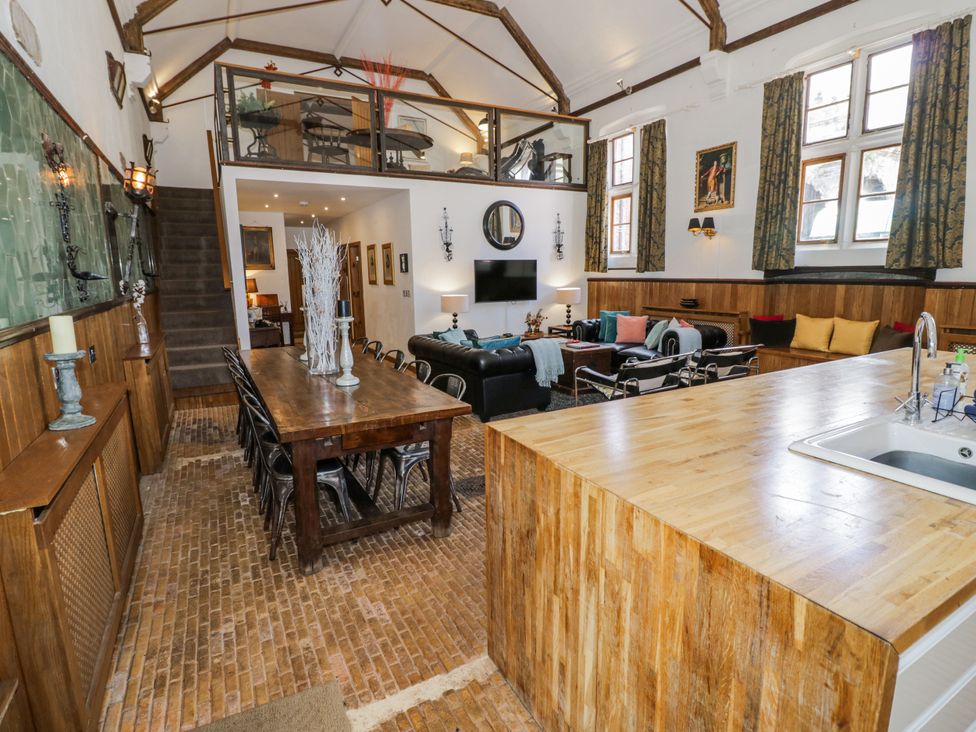 A living room with a dining table and seating area at Talbot Lodge Ingestre near Great Haywood