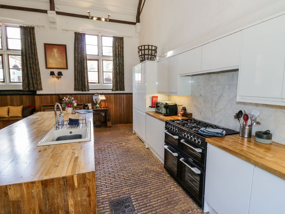 A kitchen with a sink and cooker at Talbot Lodge Ingestre near Great Haywood