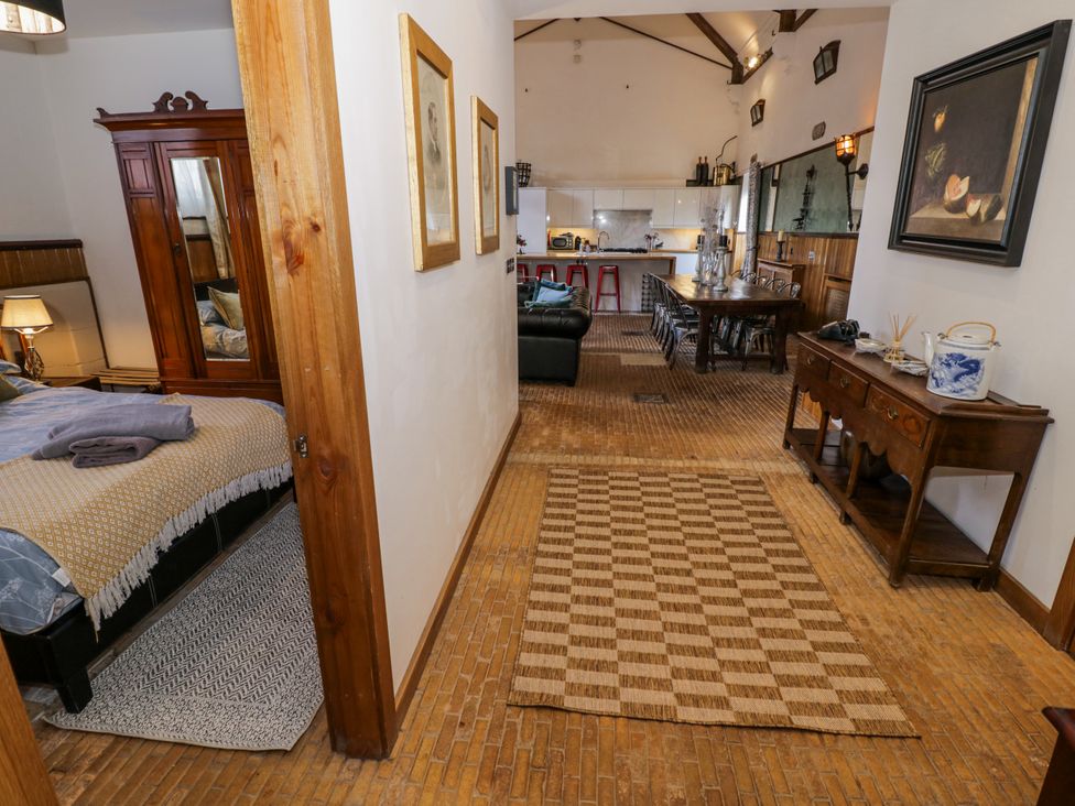 A living room and bedroom area with furniture at Talbot Lodge Ingestre near Great Haywood