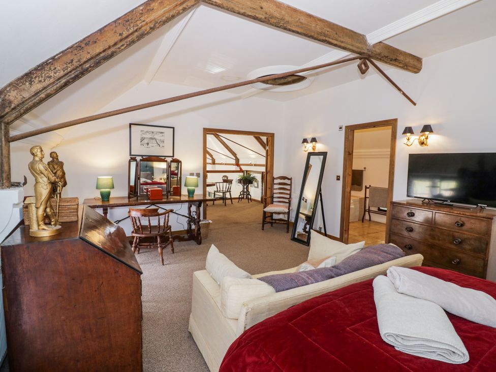 A bedroom with a bed and a chest of drawers at Talbot Lodge Ingestre near Great Haywood