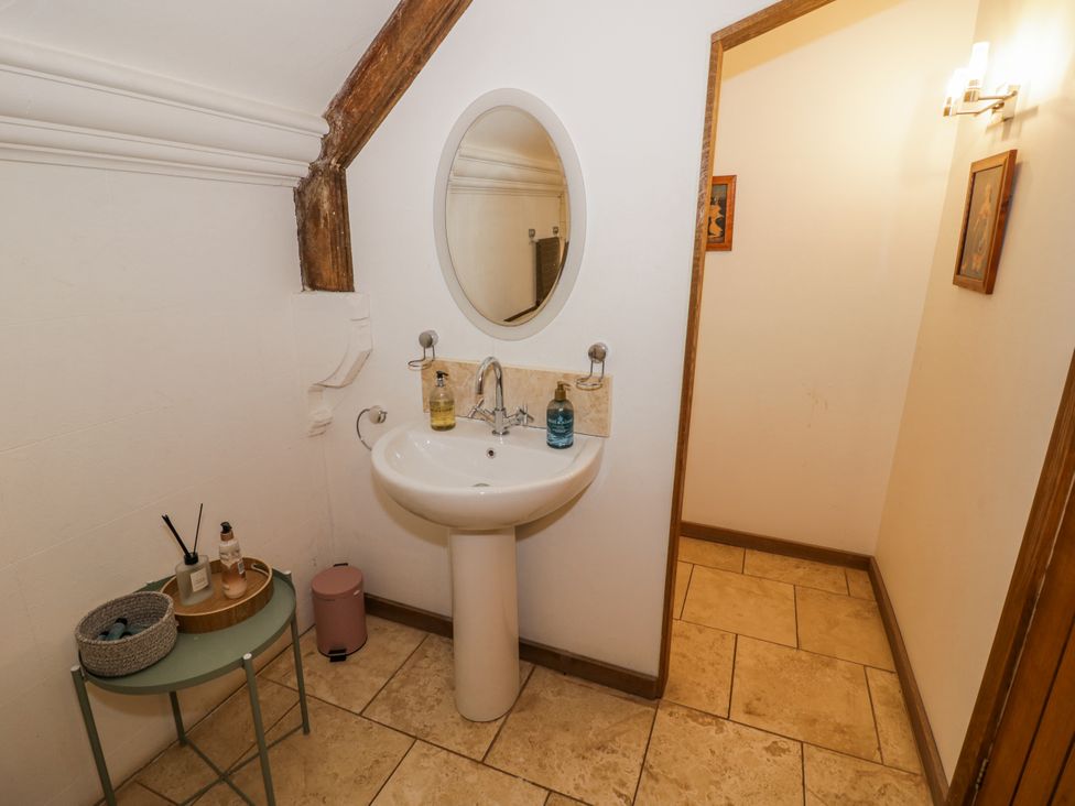 A bathroom with a sink and mirror at Talbot Lodge Ingestre near Great Haywood