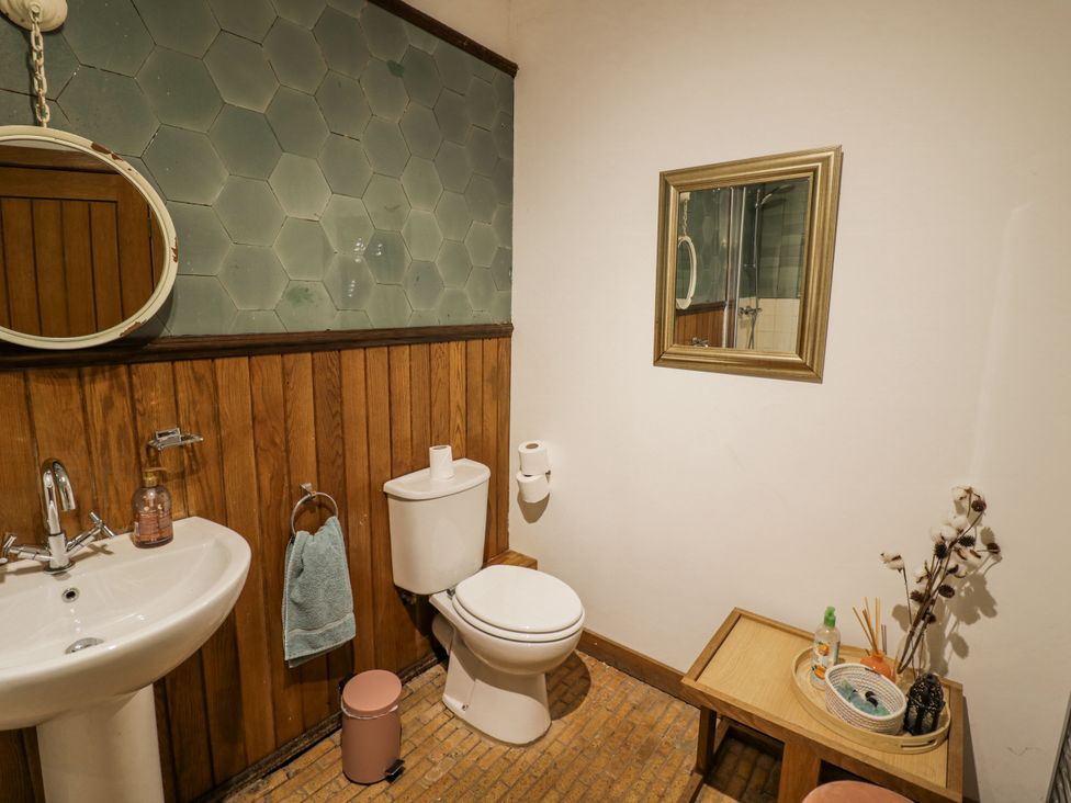 A bathroom with a sink and toilet at Talbot Lodge Ingestre near Great Haywood