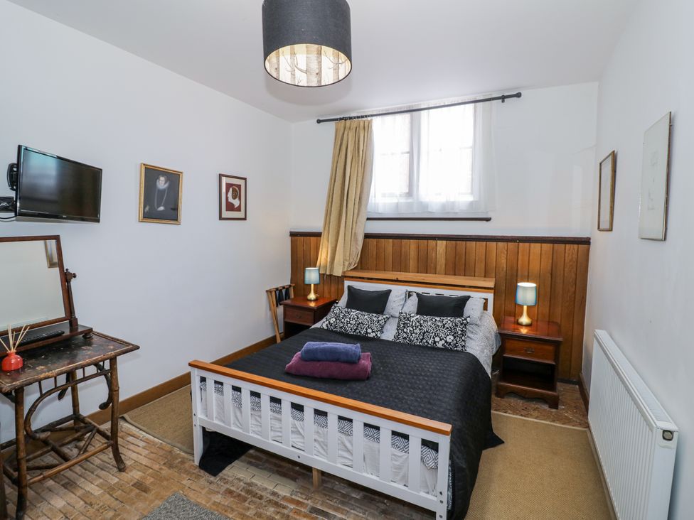 A bedroom with a bed and television at Talbot Lodge Ingestre near Great Haywood