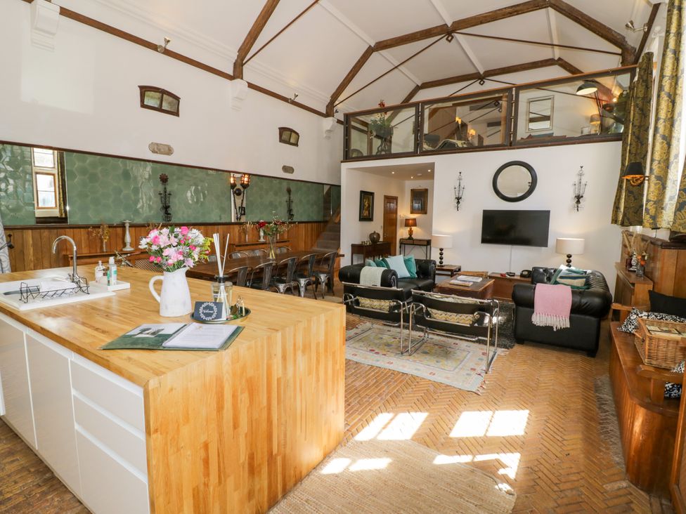 A living room with a kitchen island and seating area at Talbot Lodge Ingestre near Great Haywood