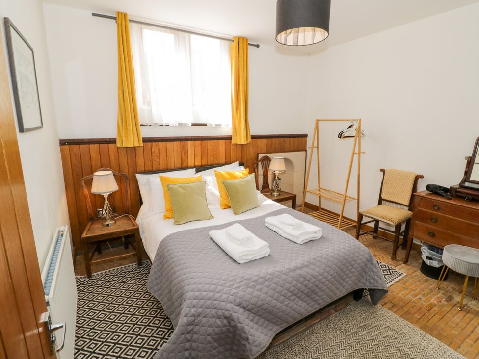 A bedroom with a bed and furniture at Talbot Lodge Ingestre near Great Haywood
