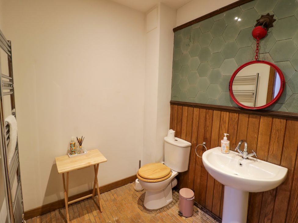 A bathroom with a toilet and sink at Talbot Lodge Ingestre near Great Haywood
