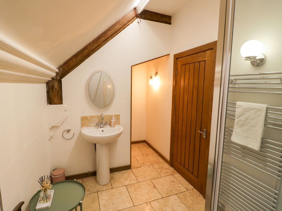 A bathroom with a sink and shower at Talbot Lodge Ingestre near Great Haywood
