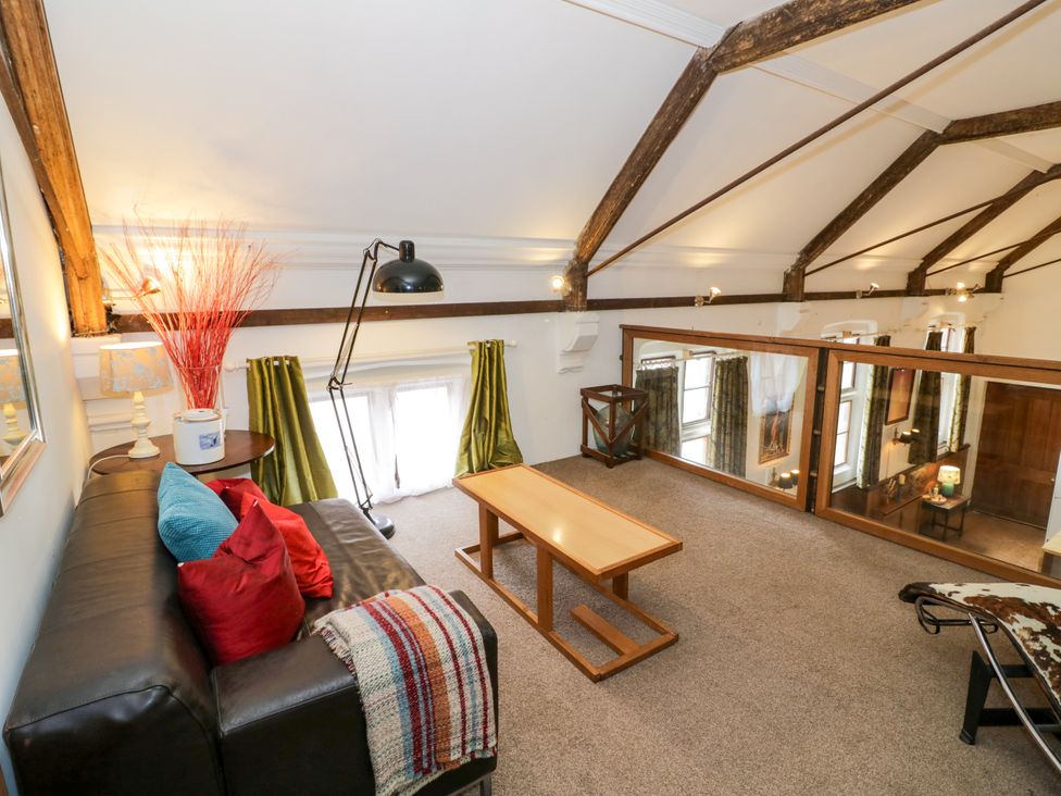 A living room with a sofa and coffee table at Talbot Lodge Ingestre near Great Haywood