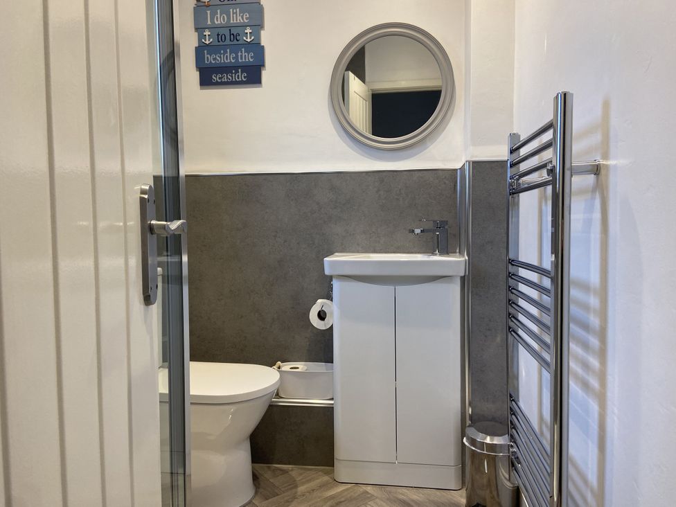 A bathroom with a sink and toilet at 22 Longstone Park Beadnell