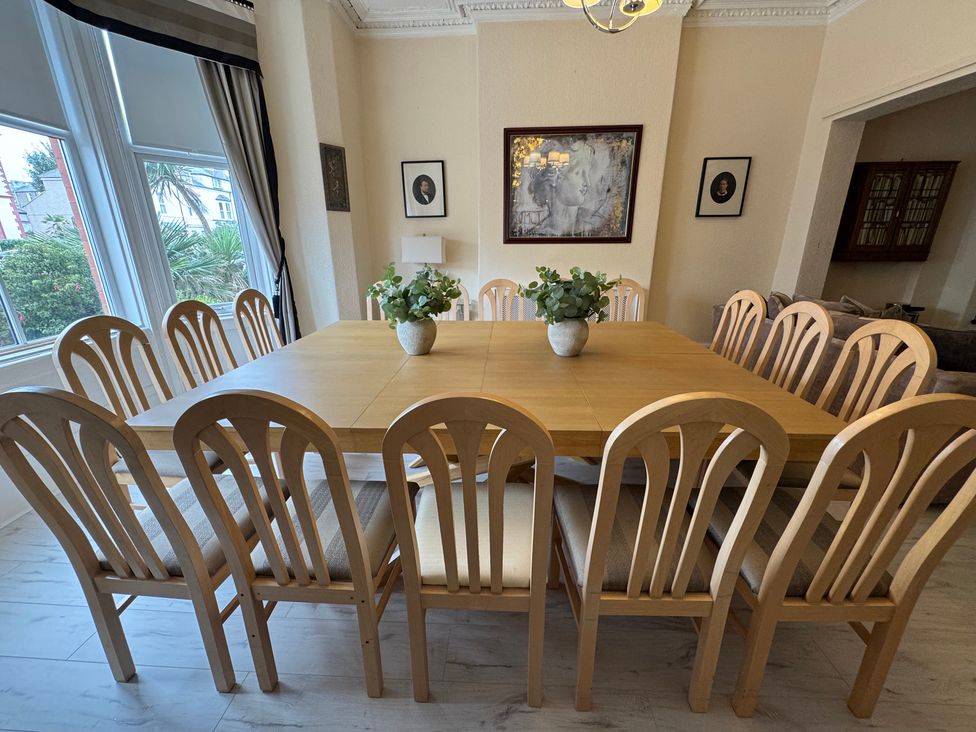 A dining room with a large table and chairs at The Causeway