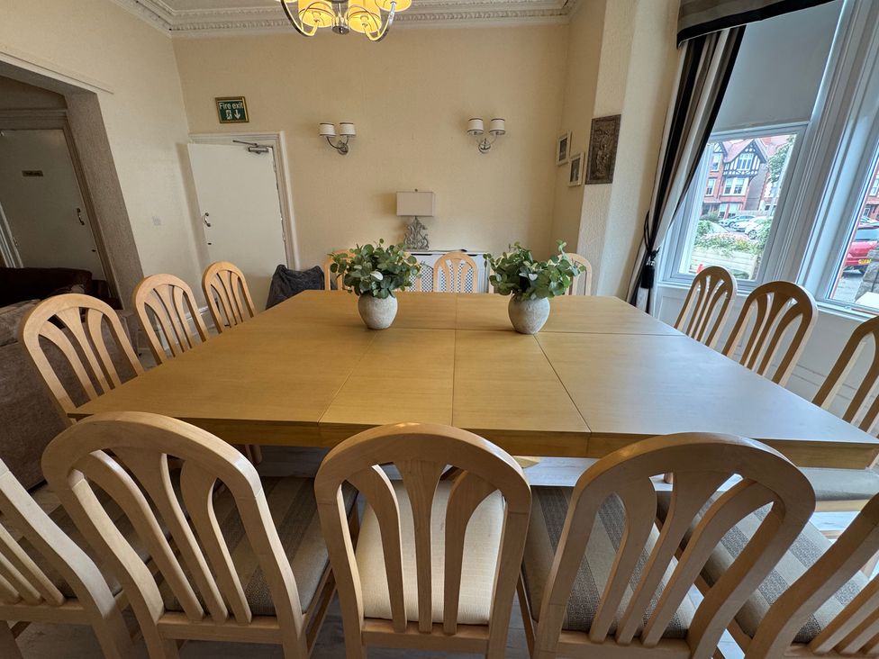 A dining room with a large table and chairs at The Causeway