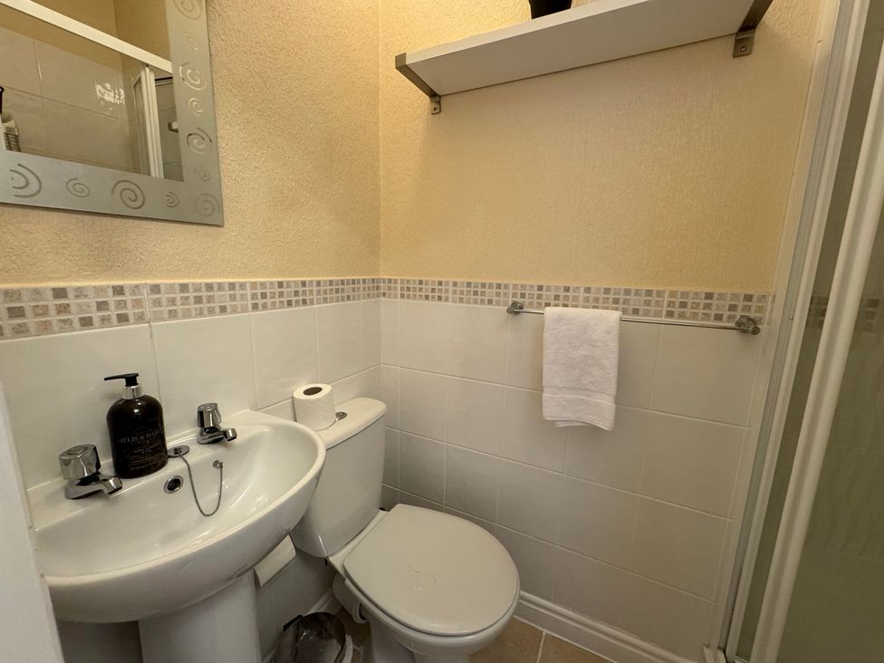 A bathroom with a sink, toilet, and shower at The Causeway in 