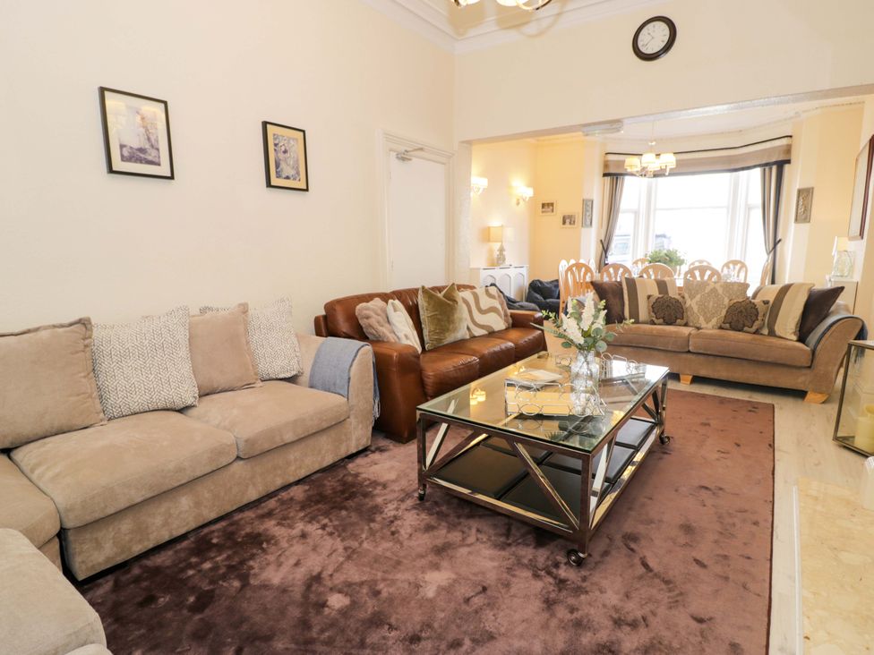 A living room with sofas and coffee table at The Causeway in Llandudno