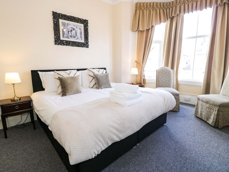 A bedroom with a bed and bedside table at The Causeway in Llandudno