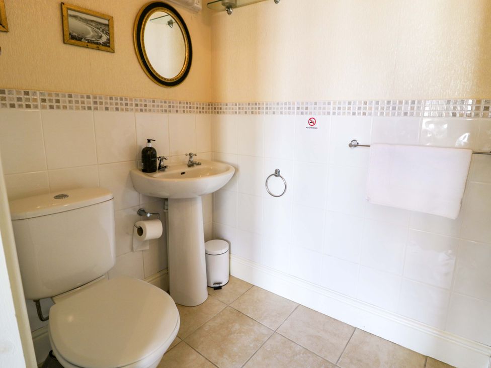 A bathroom with a sink and toilet at The Causeway in Llandudno