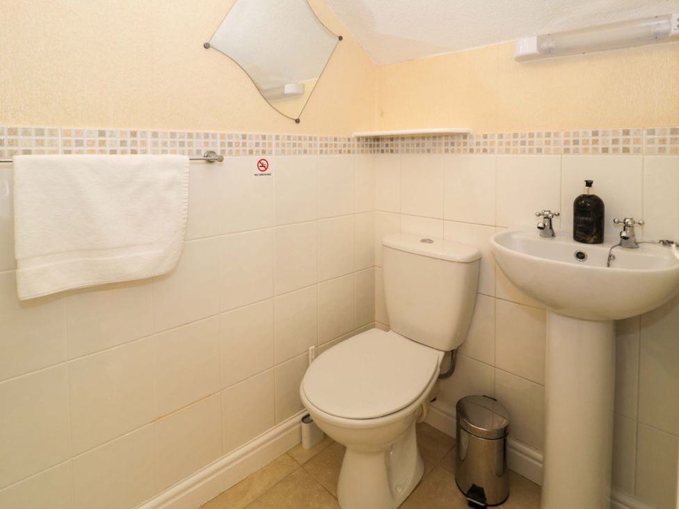 A bathroom with a sink and toilet at The Causeway in Llandudno