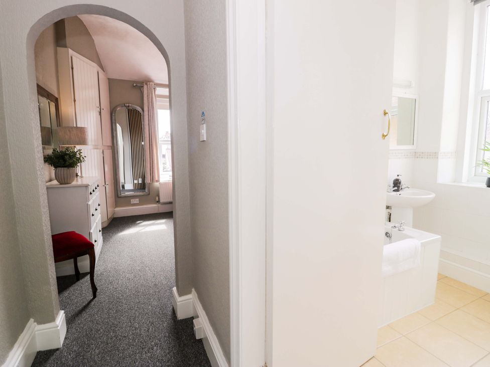A bathroom with a sink and toilet visible at The Causeway in Llandudno