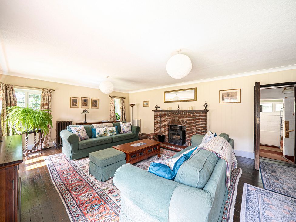 A living room with a sofa and coffee table at Primrose Spinney in Highwood near Ringwood