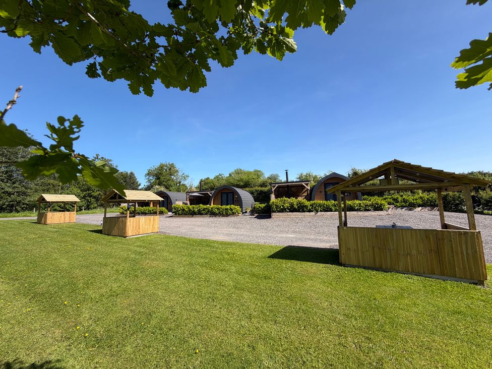 An outdoor area with cabins and shelters at Oh Deer in Ashbourne