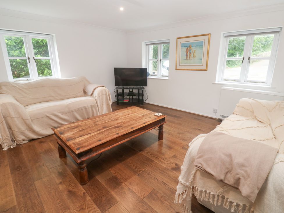 A living room with a coffee table and sofa at Sunnyvale Cottage in Rosudgeon