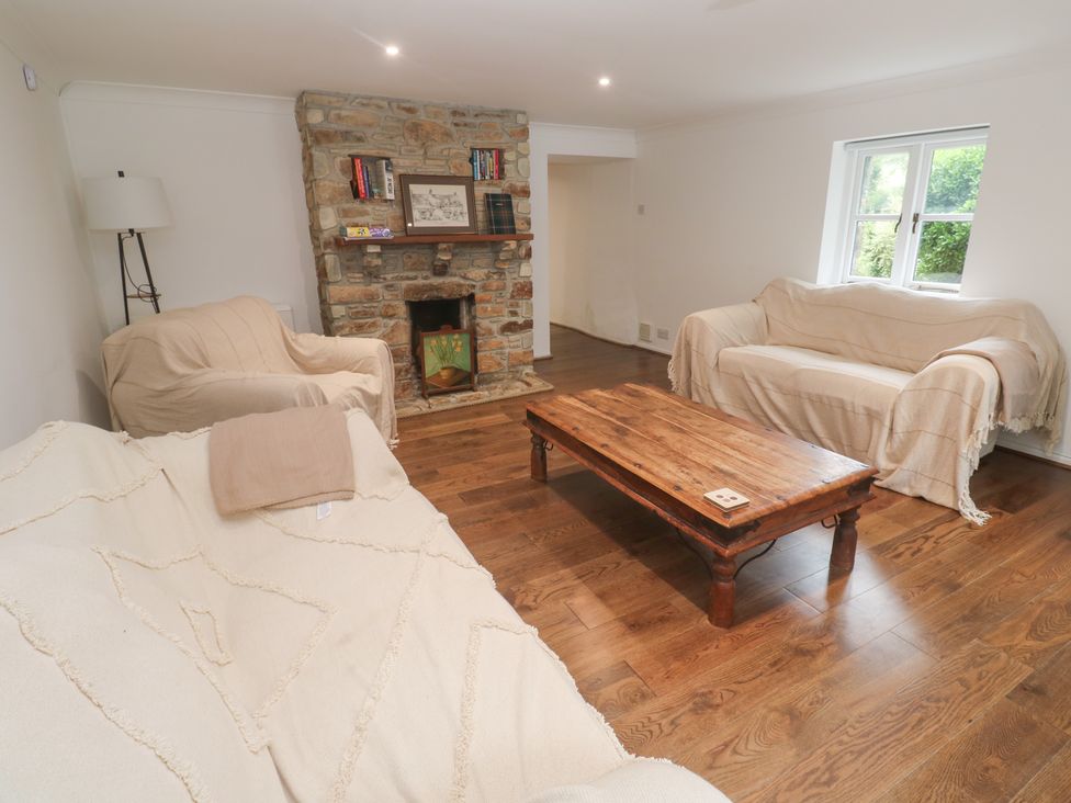 A living room with sofas and a coffee table at Sunnyvale Cottage Rosudgeon