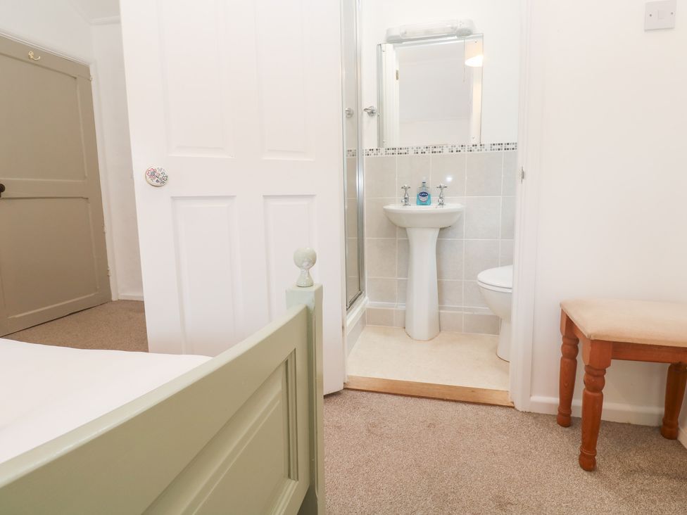 A bathroom featuring a shower, sink, and toilet at Sunnyvale Cottage in Rosudgeon