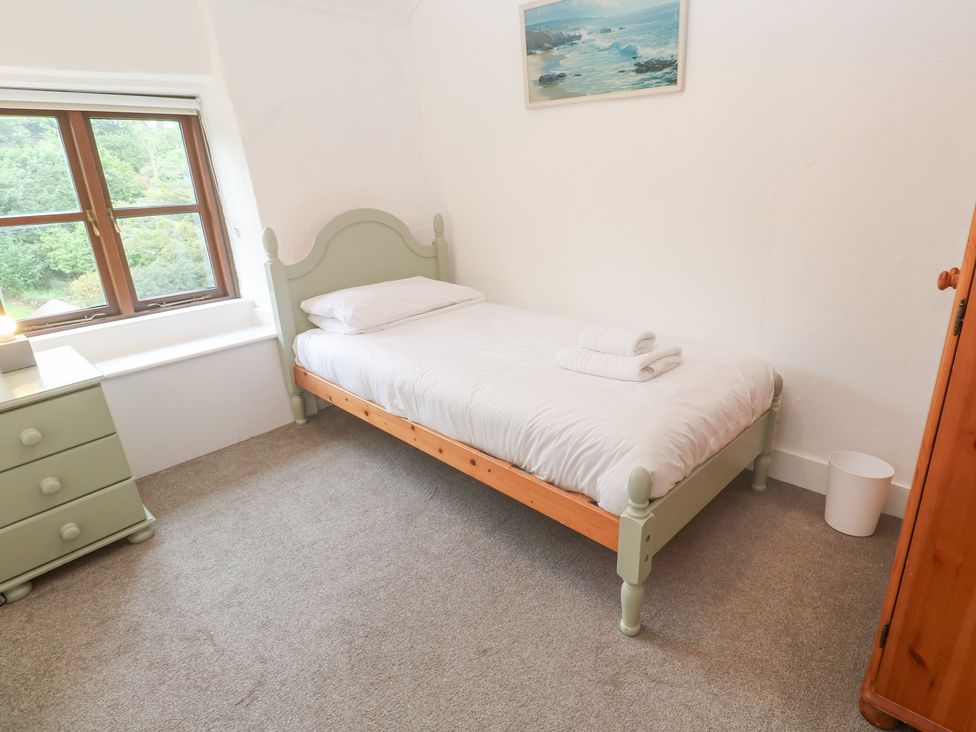 A bedroom with a single bed and dresser at Sunnyvale Cottage Rosudgeon