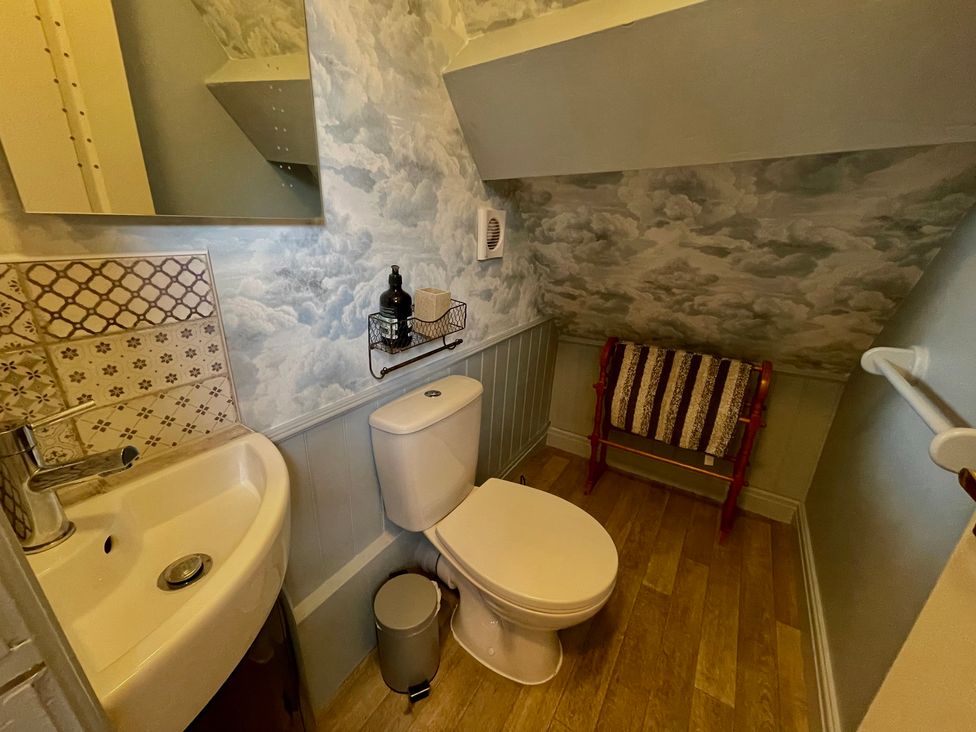 A bathroom with a sink and toilet at The Ticket Office in Ruswarp near Whitby