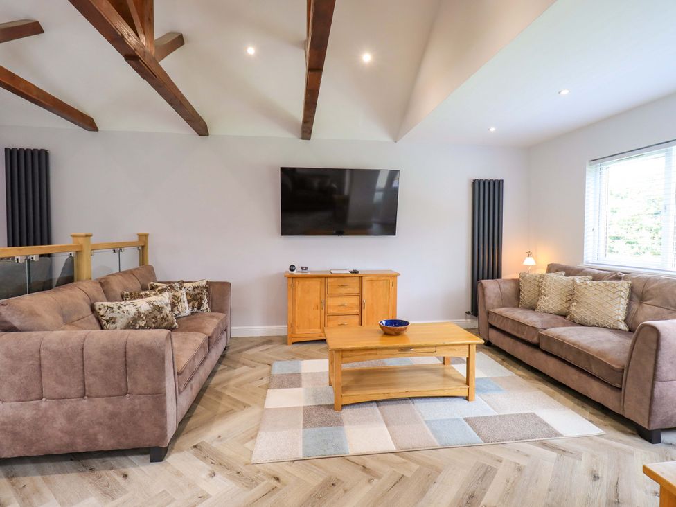 A living room with sofas and a coffee table at Mallard Cottage in Penrith