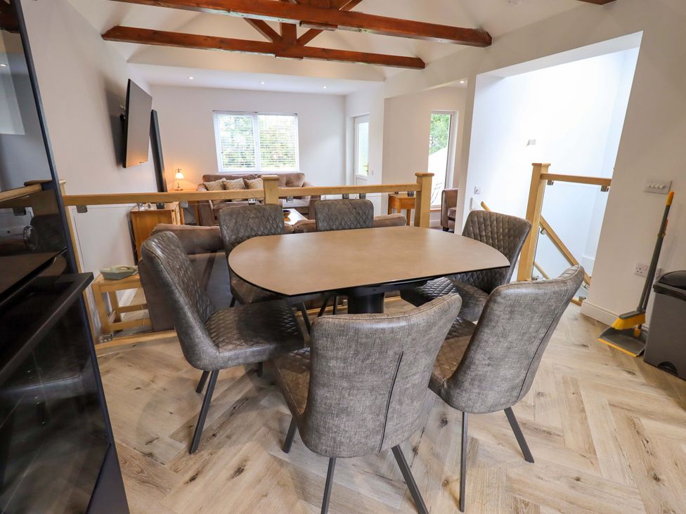 A dining room with a table and chairs at Mallard Cottage Penrith