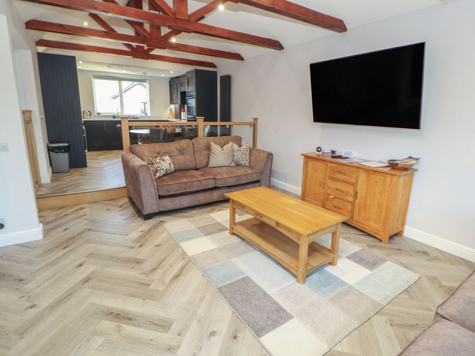 A living room with a sofa and coffee table at Mallard Cottage in Penrith