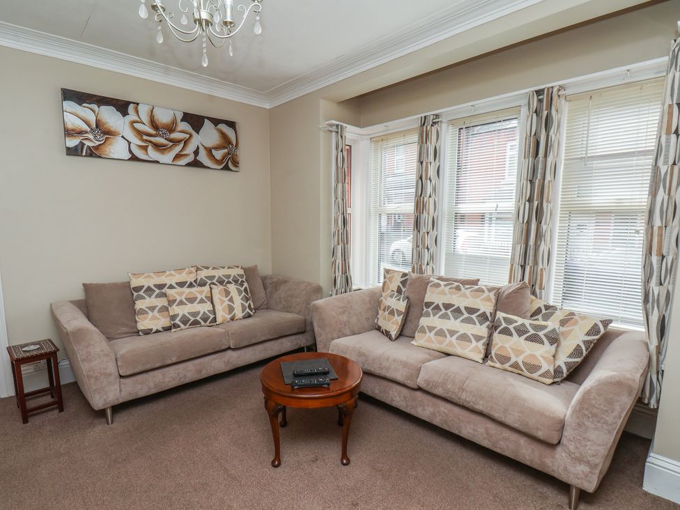 A living room with sofas and a coffee table at 35 Moorland Road in Scarborough