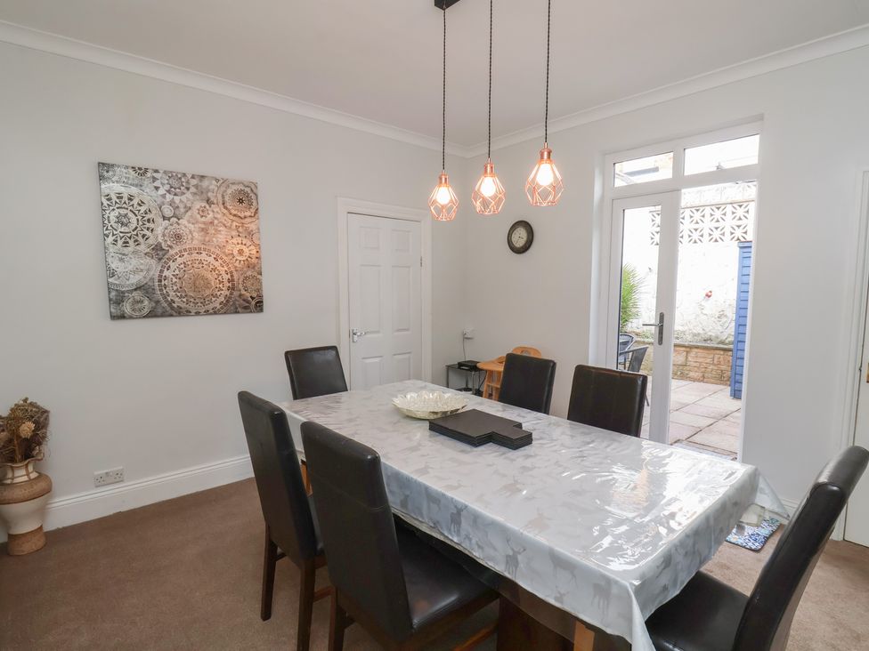 A dining room with a table and chairs at 35 Moorland Road, Scarborough