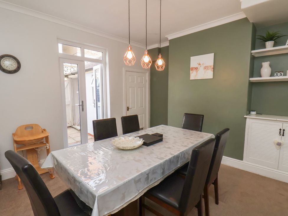 A dining room with a table and chairs at 35 Moorland Road Scarborough