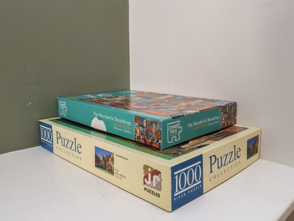 Puzzle boxes stacked on a shelf at 35 Moorland Road Scarborough