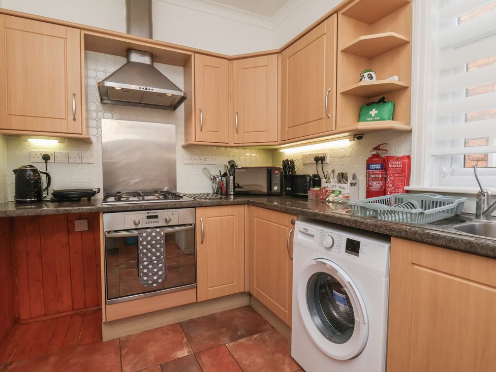 A kitchen with appliances and storage at 35 Moorland Road in Scarborough