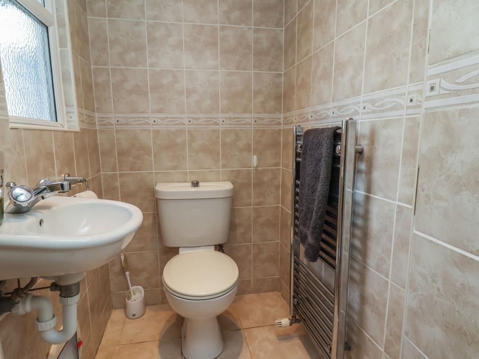 A bathroom with a sink and toilet at 35 Moorland Road, Scarborough