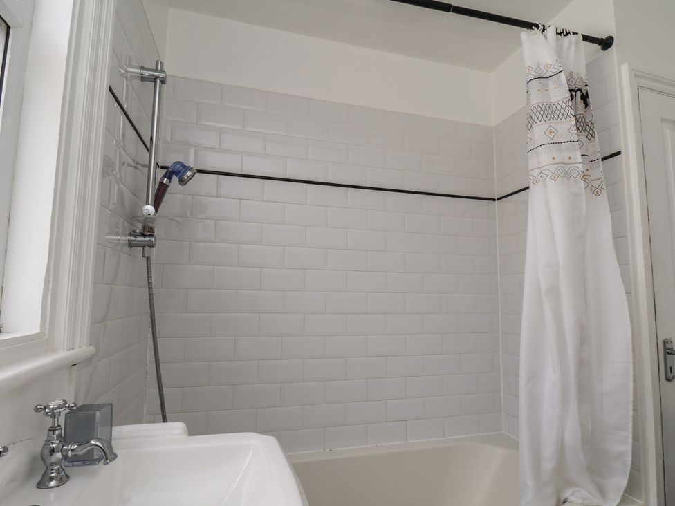 A bathroom with a bathtub and shower in 35 Moorland Road Scarborough