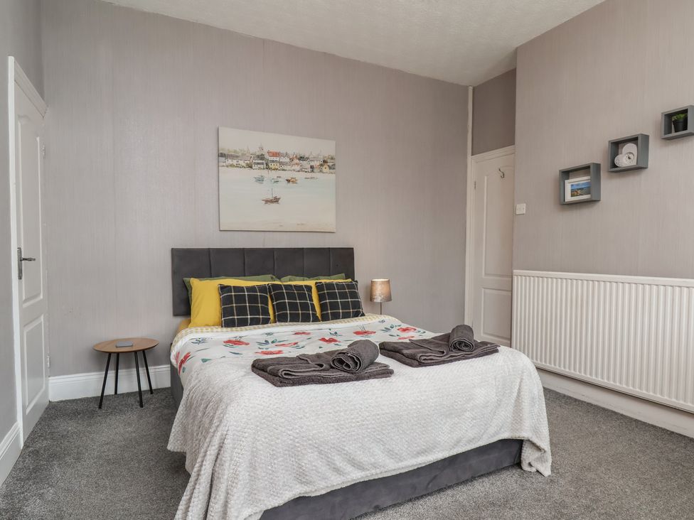 A bedroom with a bed and side table at 35 Moorland Road Scarborough